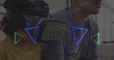 Photo for Image of neon shapes over african american man with his son using vr headset. global technology, social media and digital interface concept digitally generated image. - Royalty Free Image
