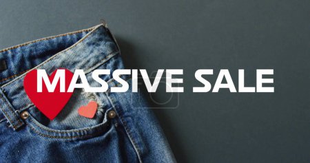 Photo for Image of massive sale text over denim trousers background. Sales, retail, shopping, digital interface, communication, computing and data processing concept digitally generated image. - Royalty Free Image