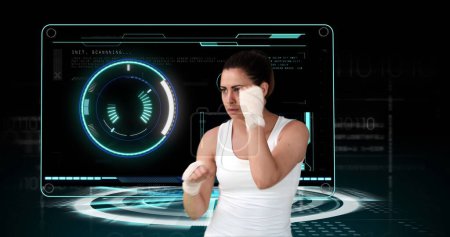 Photo for Image of female boxer with scope scanning and data processing. global sport, competition, technology, data processing and digital interface concept digitally generated image. - Royalty Free Image