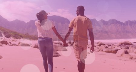 Photo for Image of light spots over african american couple walking and holding hands. walk day and celebration concept digitally generated image. - Royalty Free Image