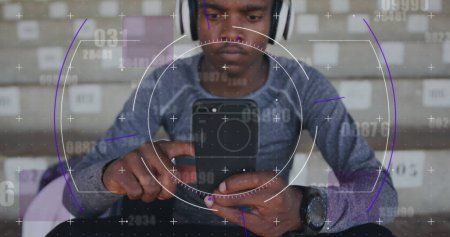 Image of digital data processing over man using smartphone and headphones. global sports, competition and digital interface concept digitally generated image.