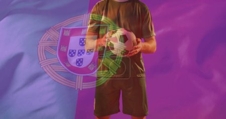 Photo for Image of caucasian male soccer player over flag of portugal. Global patriotism, celebration, sport and digital interface concept digitally generated image. - Royalty Free Image