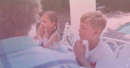 Image of caucasian family praying and having dinner. national siblings day and celebration concept digitally generated image.