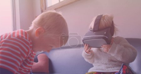 Photo for Image of smiling caucasian siblings playing with vr headset. national siblings day and celebration concept digitally generated image. - Royalty Free Image