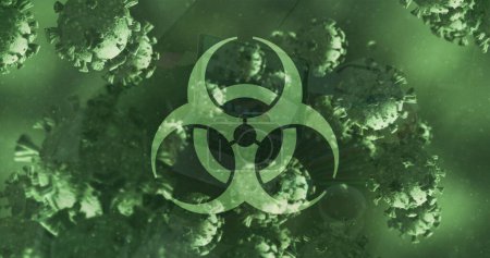 Bild des Biohazard-Zeichens und lebendiger 19 Zellen, die über grünem Hintergrund schweben. Global Covid 19 Pandemiekonzept digital generiertes Bild.