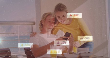 Photo for Image of social media icons on banners over smiling couple using smartphone. global social media, digital interface and communication concept digitally generated image. - Royalty Free Image