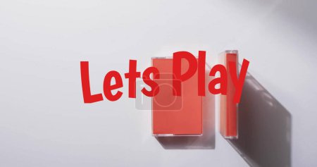 Photo for Image of let's play text over tape on white background. Technology, retro and music concept, digitally generated image. - Royalty Free Image