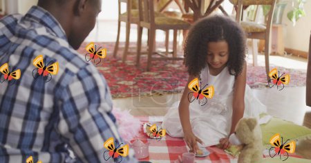 Image of flowers over happy african american father and daughter playing at home. family life, childhood, love and care concept digitally generated image.