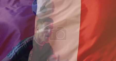 Photo for Image of caucasian male soccer player over flag of france. Global patriotism, celebration, sport and digital interface concept digitally generated image. - Royalty Free Image