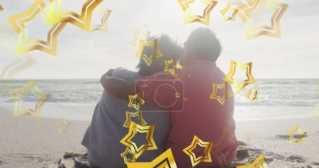 Photo for Image of stars over biracial mother and daughter at beach. Christmas, celebration and digital interface concept digitally generated image. - Royalty Free Image