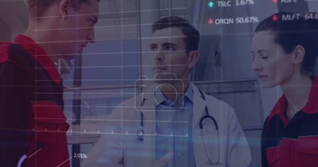 Image of data processing over caucasian male doctor and medics. Global medicine, healthcare services, connections, computing and data processing concept, digitally generated image.
