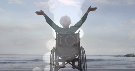 Téléchargez les photos : Image de taches de lumière sur une femme caucasienne handicapée avec les bras tendus. ne jamais abandonner le concept de jour et de célébration, image générée numériquement. - en image libre de droit