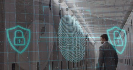 Foto de Biometric fingerprint scanner and security padlock icon over caucasian male engineer in server room. Business data storage technology concept, - Imagen libre de derechos