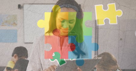 Photo for Image of colorful puzzle and brain over biracial woman with tablet and diverse children. Autism awareness month and children health concept, digitally generated image. - Royalty Free Image