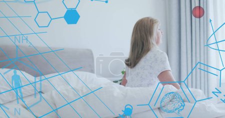 Image of medical icons and molecules over senior caucasian woman in bedroom. medical and healthcare services concept, digitally generated image.