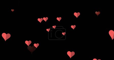 Foto de Imagen de iconos rojos del corazón flotando contra el espacio de copia sobre fondo negro. Día de San Valentín y concepto de amor - Imagen libre de derechos