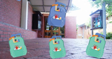 Foto de School backpacks lying on ground, revealing books inside. Each backpack, with blue background, displaying school supplies - Imagen libre de derechos