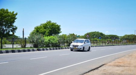 Photo for Viluppuram, India: August 28th 2022: Indian National Highway Road Travel. High speed four wheelers vehicle on Indian Road Highways, Vehicle on Indian Road . - Royalty Free Image