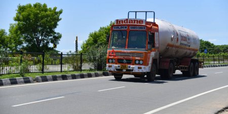 Photo for Viluppuram, India: August 28th 2022: Fuel Truck Carrying Petrol Or Diesel on Indian National Highway Road Travel. High Speed Heavy Duty Vehicle On Indian Road Highways, Oil lorry vehicle on Road. - Royalty Free Image