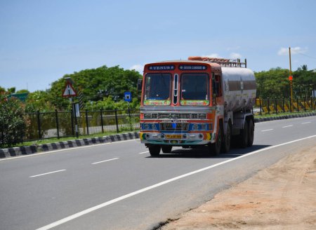 Photo for Viluppuram, India: August 28th 2022: Fuel Truck Carrying Petrol Or Diesel on Indian National Highway Road Travel. High Speed Heavy Duty Vehicle On Indian Road Highways, Oil lorry vehicle on Road. - Royalty Free Image
