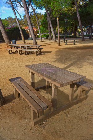 Photo for Empty wooden table and chairs on the beach - Royalty Free Image