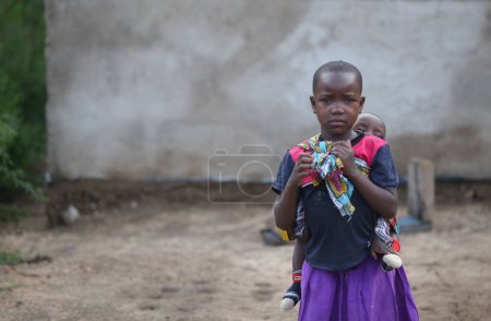 Photo for A little girl looking after a baby in Zanzibar 03 21 201 - Royalty Free Image