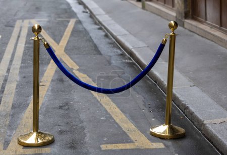 Photo for Yellow metal barrier with blue tape on Paris street - Royalty Free Image