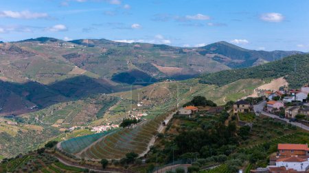 View of the terraced vineyards in the Douro Valley and river near the village of Pinhao, Portugal. Concept for travel in Portugal and most beautiful places in Portugal