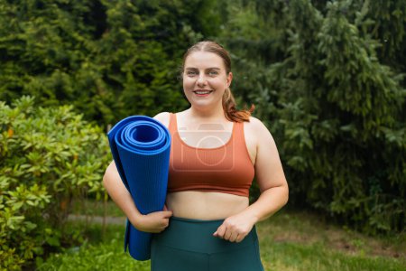 Photo for Young fat fitness trainer instructor woman spend time outdoors background. Workout sport concept. High quality photo - Royalty Free Image