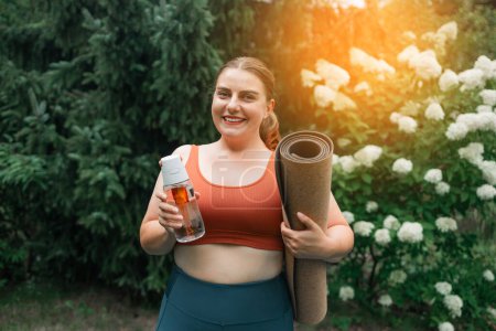 Photo for Young fat fitness trainer instructor woman spend time outdoors background. Workout sport concept. High quality photo - Royalty Free Image