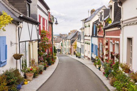 Photo for Idyllic flower decorated street in the old town of Valery-sur-Somme, Hauts-de-France, France - Royalty Free Image