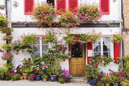 Photo for Idyllic flower decorated house in the old town of Valery-sur-Somme, France - Royalty Free Image