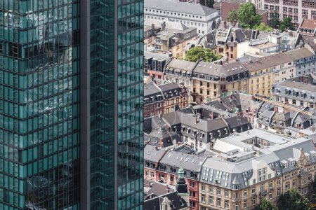 Photo for Picture with an aerial view of a skyscraper and old townhouses in Frankfurt am Main, Germany - Royalty Free Image