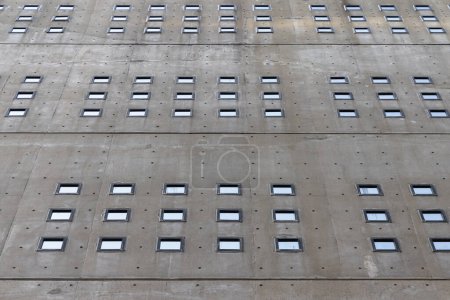 Photo for Picture of a wall with small windows of a concrete building - Royalty Free Image
