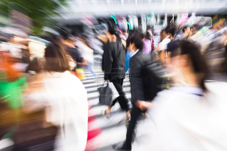 Photo for Picture with camera made zoom effect of crowds of people crossing the Shibuya crossing in Tokyo, Japan - Royalty Free Image