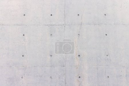 Téléchargez les photos : Grunge comme texture de fond d'un mur en béton gris clair - en image libre de droit