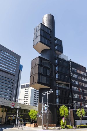 Photo for Tokyo, Japan - April 10, 2023: Shizuoka Press and Broadcasting Center in Ginza. Built in 1967, it is considered to be the first realization of Kenzo Tange's Metabolist movement - Royalty Free Image