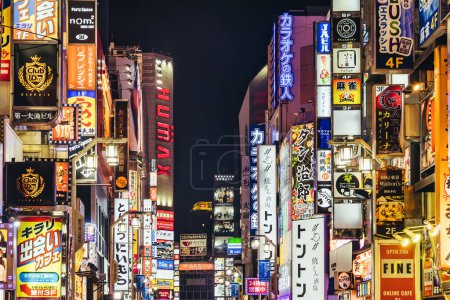 Photo for Tokyo, Japan - April 11, 2023: main street of Kabukicho with illuminated neon lights at night. Kabukicho is a famous entertainment district in Shinjuku with many movie theaters hostess clubs and love hotelsTokyo, - Royalty Free Image