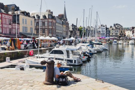 Photo for Honfleur, France - June 03, 2023: port of Honfleur with unidentified people in Calvados department, Normandy. Honfleur is known for its old port, characterized by its slate-covered houses - Royalty Free Image