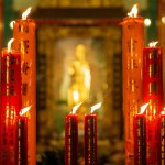 Chinese candle burning on Chinese temple for asian witchcraft praying to spirit god at night