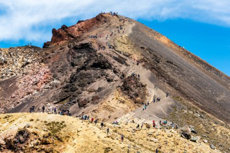 Queue of people on the crossing descending from Red Crater to the Emerald Lakes on the Tongariro alpine crossing walk