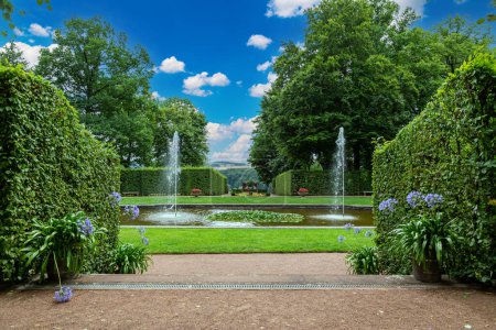 Photo for Ancient Lichtenwalde Castle and Park outdoors  at beautiful summer day. Baroque garden.  Saxony. Germany. Tourist attraction,  place of visiting tourists. - Royalty Free Image
