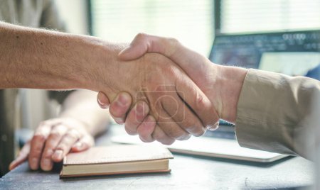 Photo for Handshake exemplifies values of trust, collaboration, and teamwork within corporate environment, emphasizing importance of establishing strong connections in business world. Close-up, hands of two men - Royalty Free Image