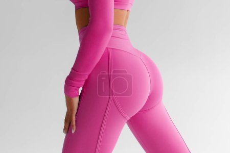 Photo for Fitness model in leggings with beautiful buttocks. Sporty booty - Royalty Free Image