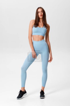 Photo for Fitness woman. Athletic girl on the gray background - Royalty Free Image