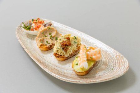 Photo for Seafood bruschetta served on a plate - Royalty Free Image