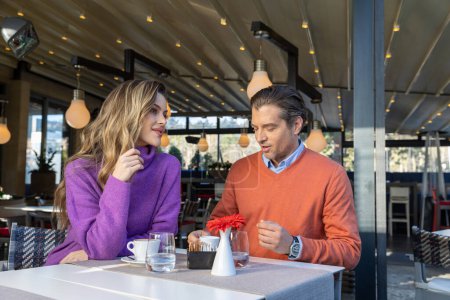 Photo for Beautiful couple drinking coffee in cafe bar - Royalty Free Image