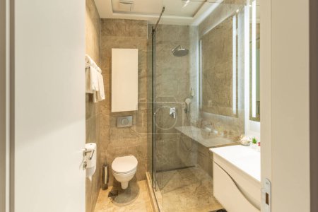 Photo for Bathroom interior with glass shower cabin - Royalty Free Image