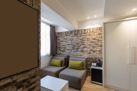 Téléchargez les photos : Interior of a modern hotel apartment with brick wall decoration - en image libre de droit