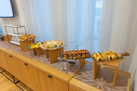 Photo for Food served on a banquet table in a meeting room - Royalty Free Image